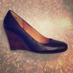 Clark’s black leather wedges
